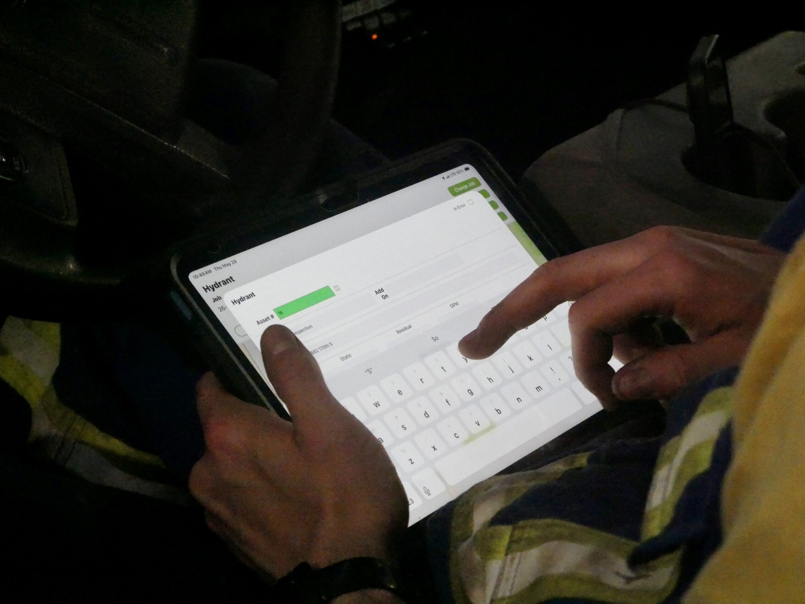 Field worker entering infrastructure inspection data into a tablet using Cam-Trac’s MARS™ program.