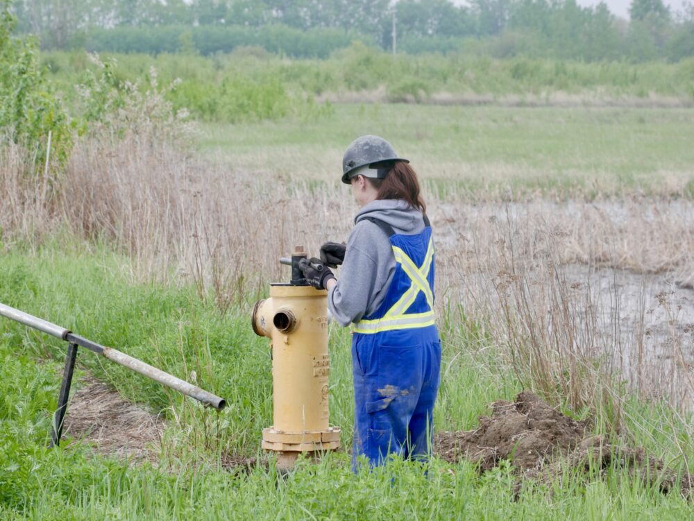 Cam-Trac team member working on a fire hydrant during field operations