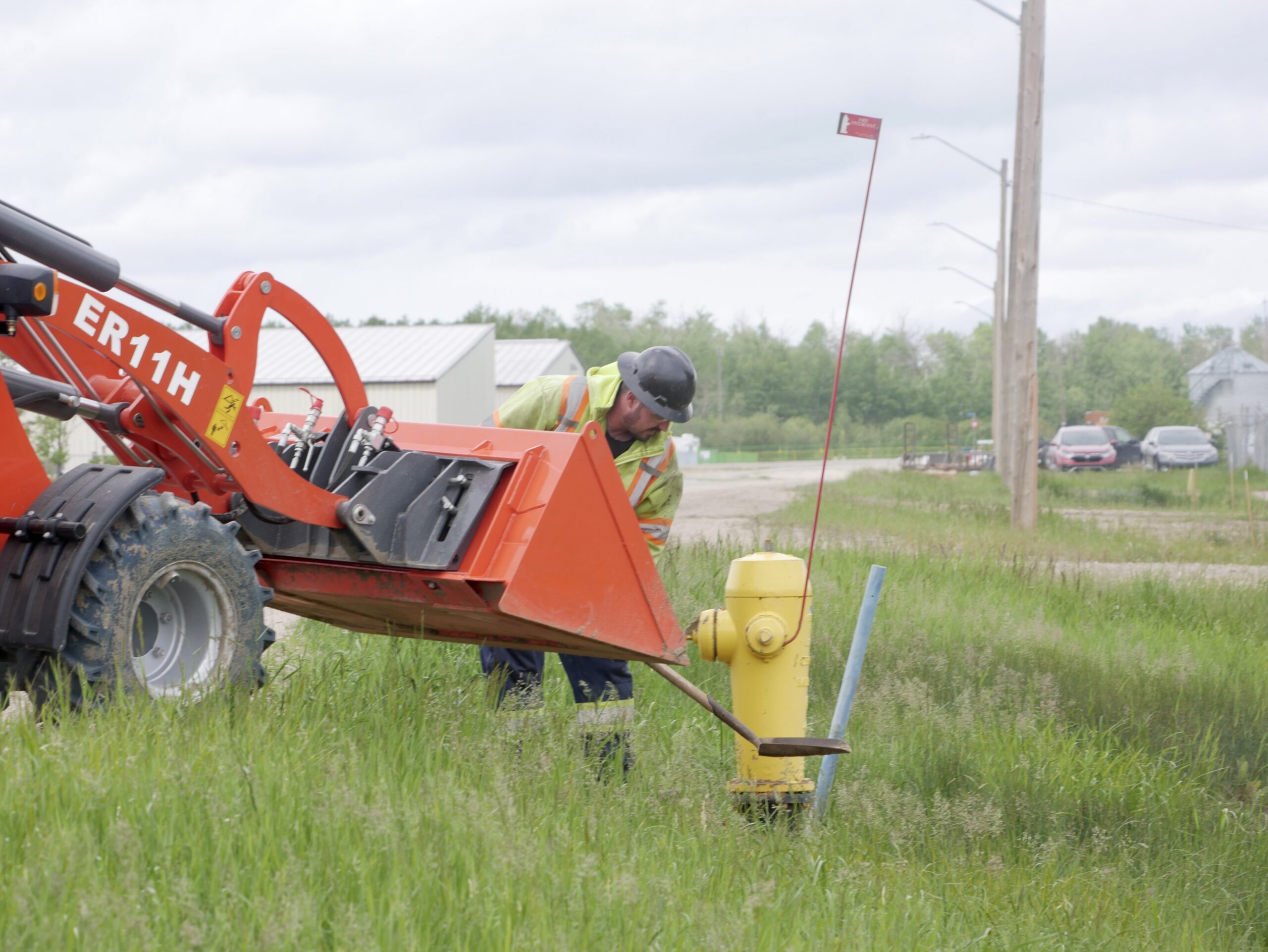 Cam-Trac team member performing work on a fire hydrant during field operations